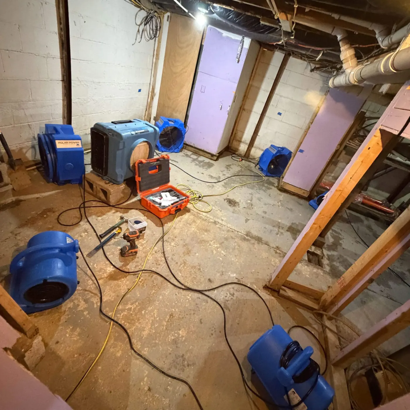 Sewage cleanup crew in PPE on-site in Eagle Village, IN